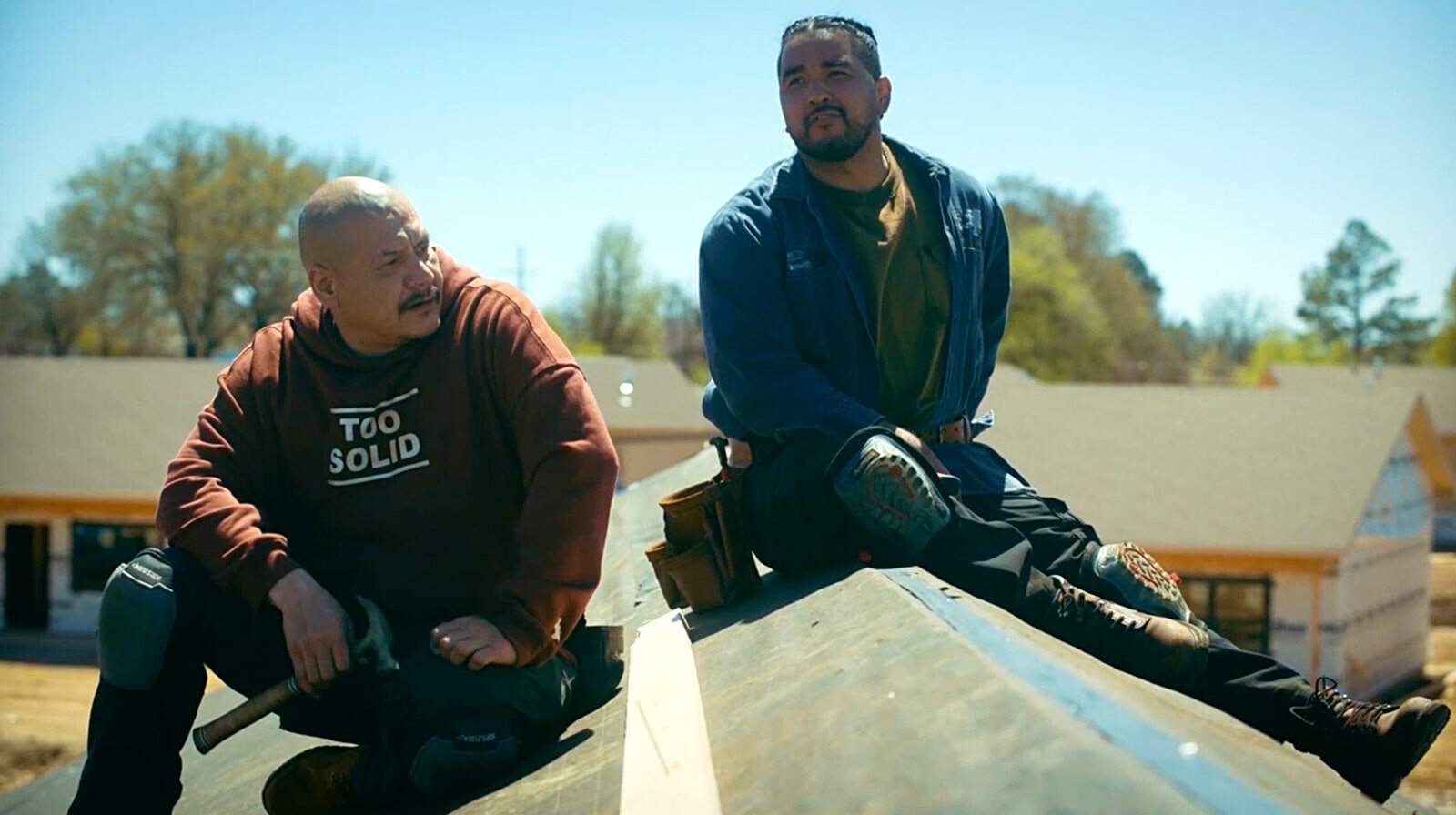 Characters from the FX show Reservation Dogs roofing home with an Estwing Hammer