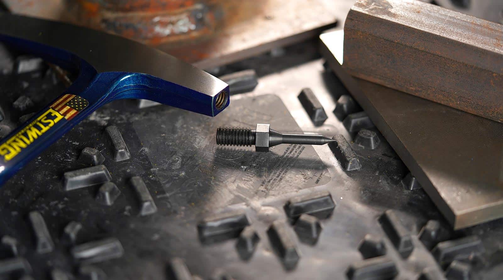 New Estwing Welding Chipping Hammer with Replaceable Tips on workbench.